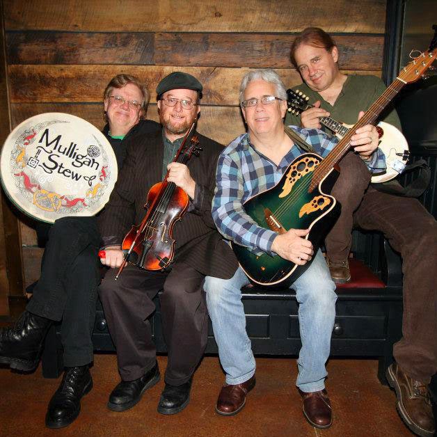 Picture of a band sitting on a bench
