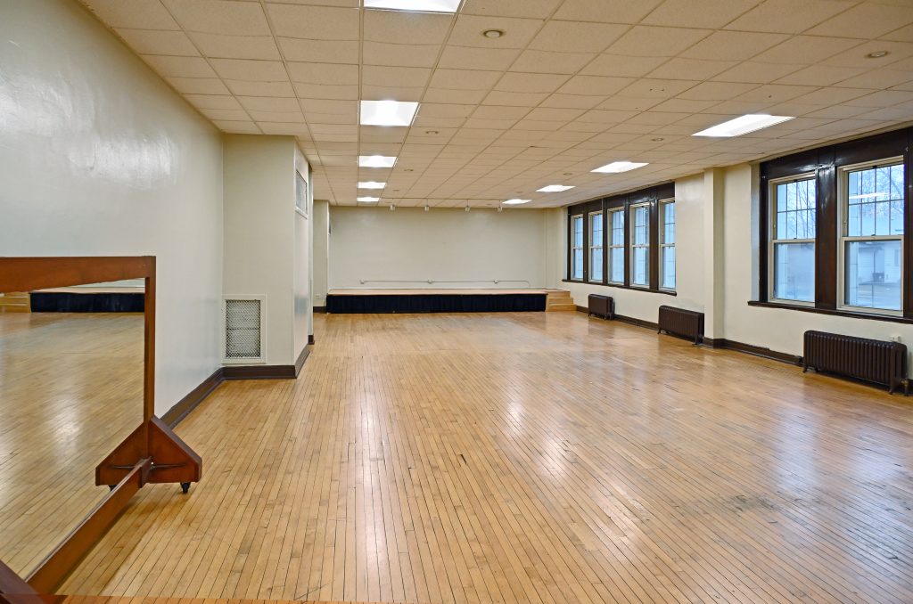 A picture of the room with a small mirror on the left