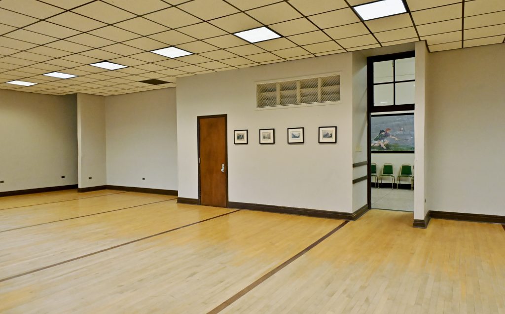 Picture of the room with small photo frames and one open door