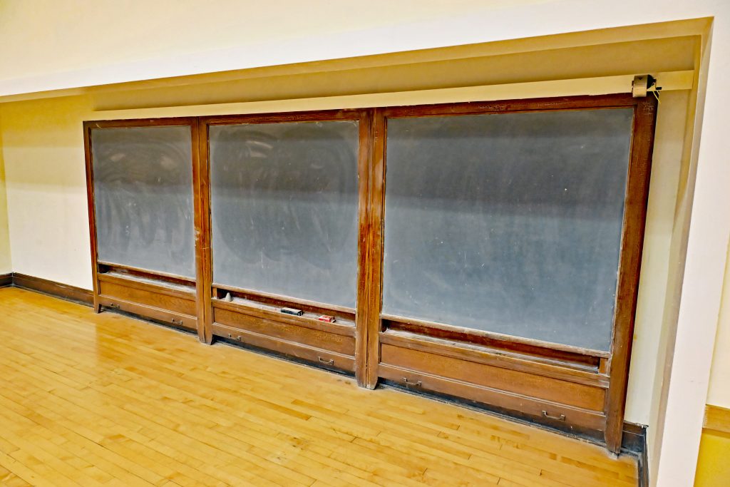 A picture of a three section chalkboard
